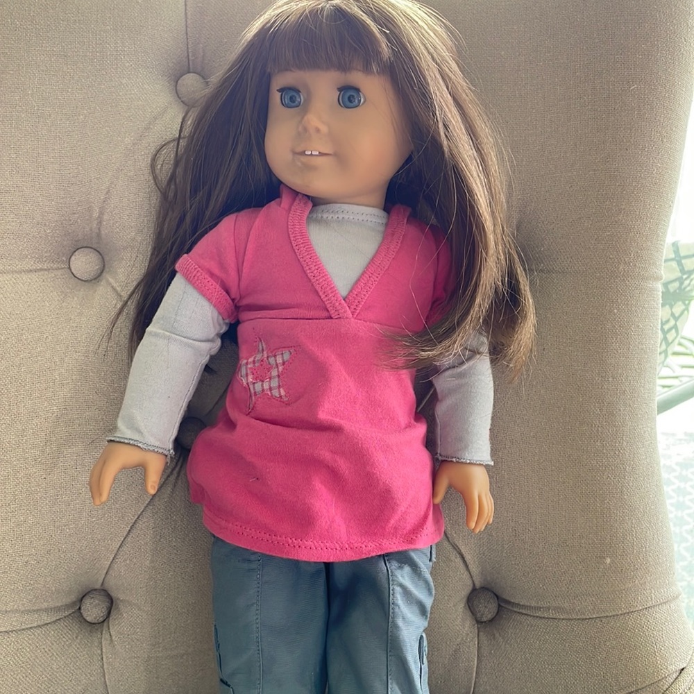 Create your own American Girl Doll. Medium skin, brown hair, blue eyes.
